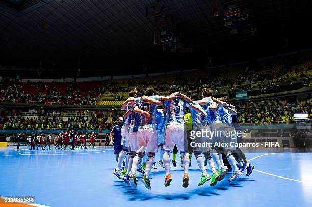 Players of Argentina celebrate after the FIFA Futsal World Cup Semi-Final match between Argentina and Portugal at the Coliseo El Pueblo stadium on...