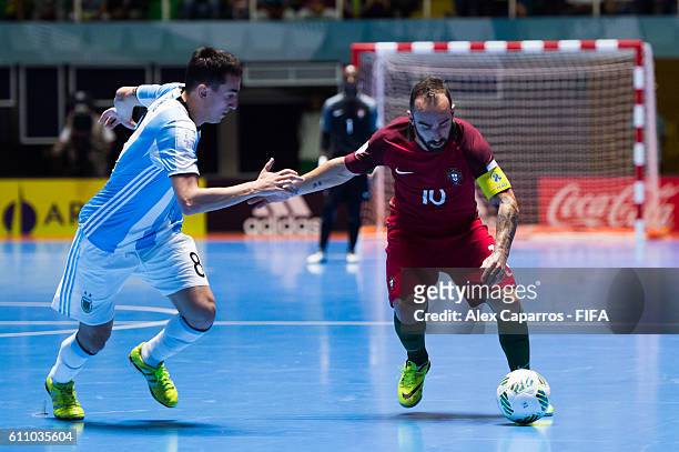 Ricardinho of Portugal conducts the ball next to Santiago Basile of Argentina during the FIFA Futsal World Cup Semi-Final match between Argentina and...