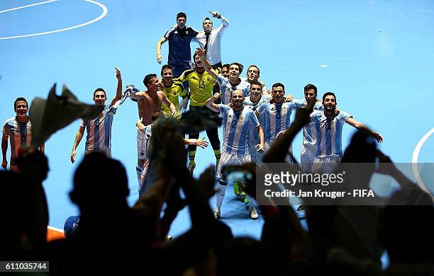 Argentina players celebrate with their fans after victory during the FIFA Futsal World Cup semi-final match between Argentina and Portugal at Coliseo...