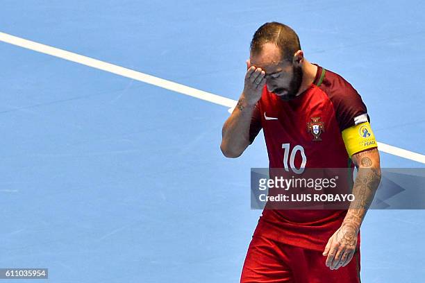 Portugal's Ricardinho reacts after being defeated by Argentina during their Colombia 2016 FIFA Futsal World Cup match at the Coliseo El Pueblo...