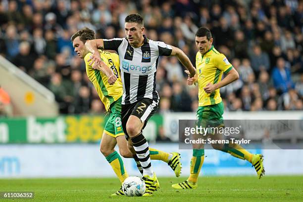 Ciaran Clark of Newcastle United runs with the ball and is fouled by Jonny Howson of Norwich City during the Sky Bet Championship match between...