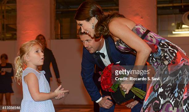 Crown Prince Frederik and HRH Princess Mary of Denmark, speak to 4 years old Dagmar Moelier at the Smithsonian's Arts and Industry building for a...