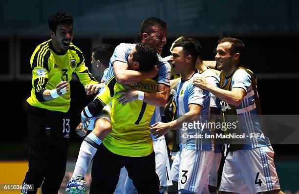 Guido Mosenson of Argentina and Nicolas Sarmiento of Argentina celebrate at the final whistle during the FIFA Futsal World Cup Semi Final match...