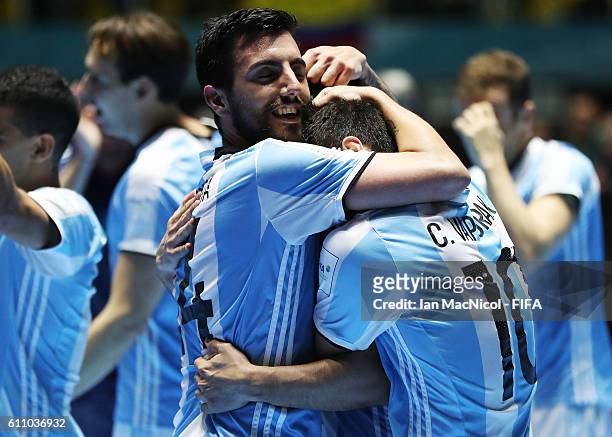 Pablo Taborda and Constantino Vaporaki of Argentina celebrate at full time during the FIFA Futsal World Cup Semi Final match between Argentina and...