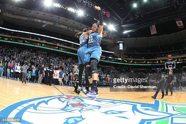Maya Moore of the Minnesota Lynx celebrates with Keisha Hampton of the Minnesota Lynx after the game against the Phoenix Mercury in Game One of the...