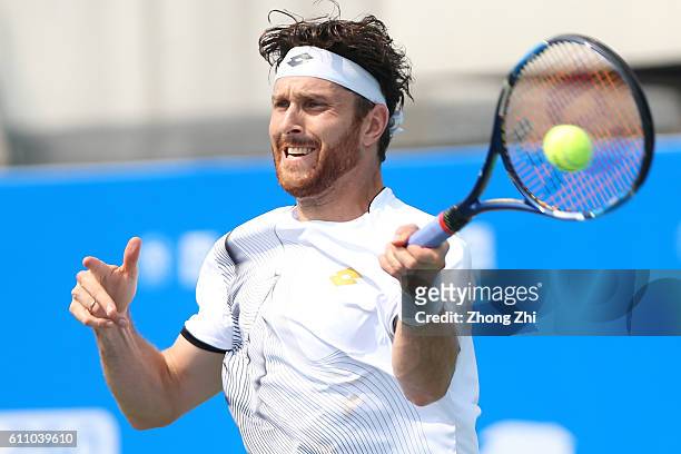 Michael Berrer of Germany returns a shot during the match against Albert Ramos-Vinolas of Spain during Day 3 of 2016 ATP Chengdu Open at Sichuan...