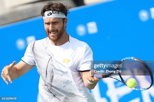 Michael Berrer of Germany returns a shot during the match against Albert Ramos-Vinolas of Spain during Day 3 of 2016 ATP Chengdu Open at Sichuan...