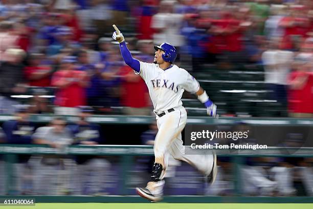 Carlos Gomez of the Texas Rangers celebrates after hitting a three run home run off of Tyler Thornburg of the Milwaukee Brewers in the bottom of the...