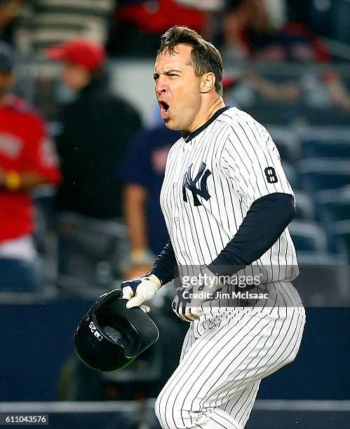 Mark Teixeira of the New York Yankees celebrates his game winning ninth inning grand slam home run against the Boston Red Sox at Yankee Stadium on...