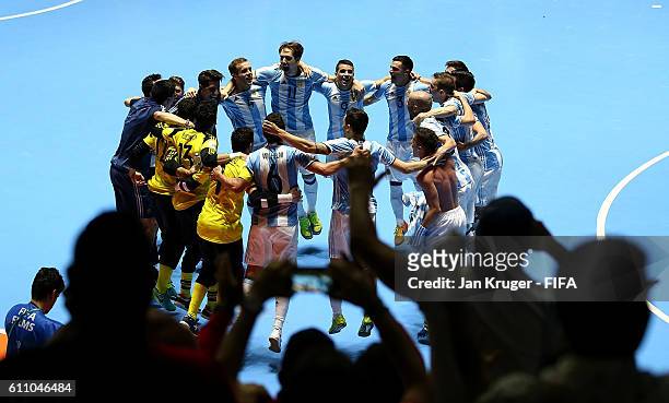 Argentina players celebrate victory during the FIFA Futsal World Cup semi-final match between Argentina and Portugal at Coliseo el Pueblo on...