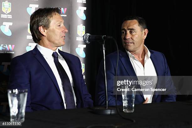 Melbourne Storm coach Craig Bellamy talks to Cronulla Sharks coach Shane Flanagan during the media during the NRL Grand Final press conference at...