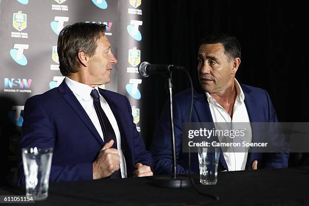 Melbourne Storm coach Craig Bellamy talks to Cronulla Sharks coach Shane Flanagan during the media during the NRL Grand Final press conference at...