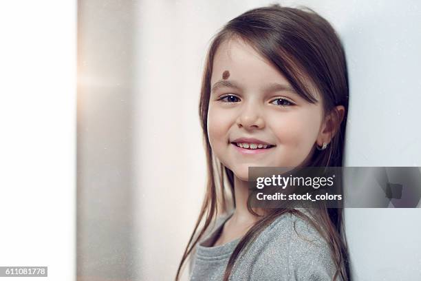 smile of little girl - mole stock pictures, royalty-free photos & images