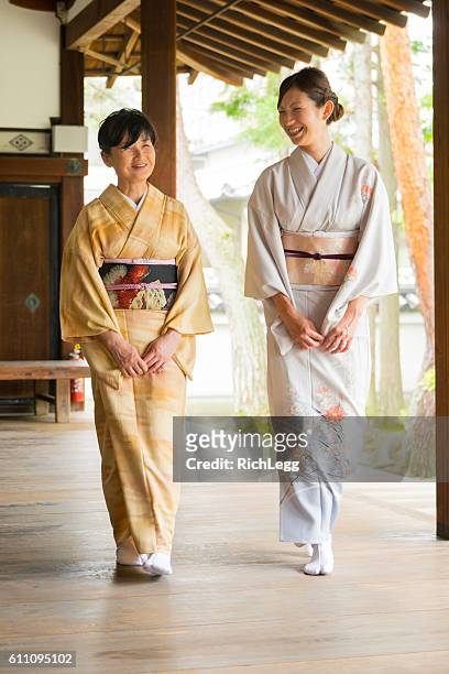 japanese women at the temple - kimono stock pictures, royalty-free photos & images