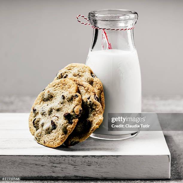 milk and chocolate chip cookies - chocolate milk bottle stock pictures, royalty-free photos & images