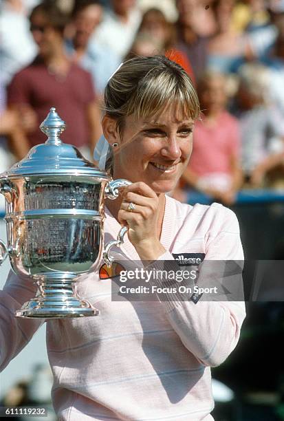 Tennis player Chris Evert of the United States hold of the trophy after defeating Hana Mandlikova in finals of the women 1982 U.S. Open Tennis...