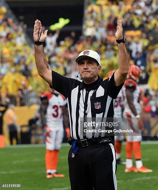 National Football League referee Pete Morelli signals touchdown during a game between the Cincinnati Bengals and Pittsburgh Steelers at Heinz Field...