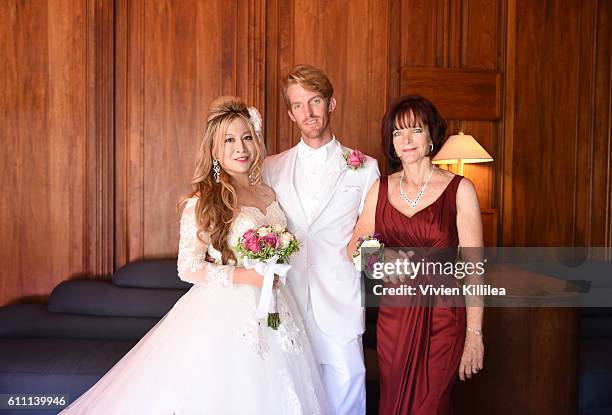 Alice Aoki, Justin Moore and Karen Moore at the Aoki wedding ceremony at the Avalon Theater on September 25, 2016 on Catalina Island, California.