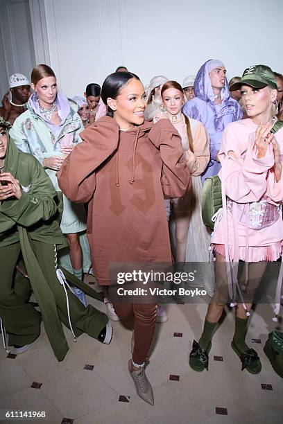 Rihanna is seen with models backstage during FENTY x PUMA by Rihanna at Hotel Salomon de Rothschild on September 28, 2016 in Paris, France.