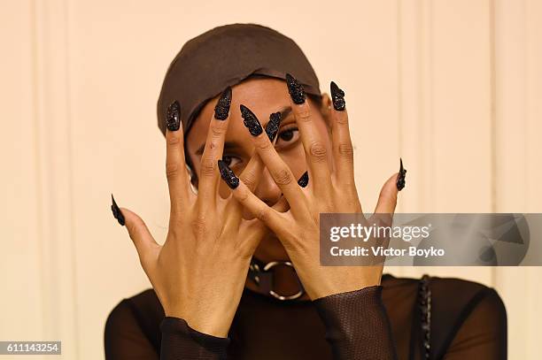 Model, hand detail, poses backstage during FENTY x PUMA by Rihanna at Hotel Salomon de Rothschild on September 28, 2016 in Paris, France.