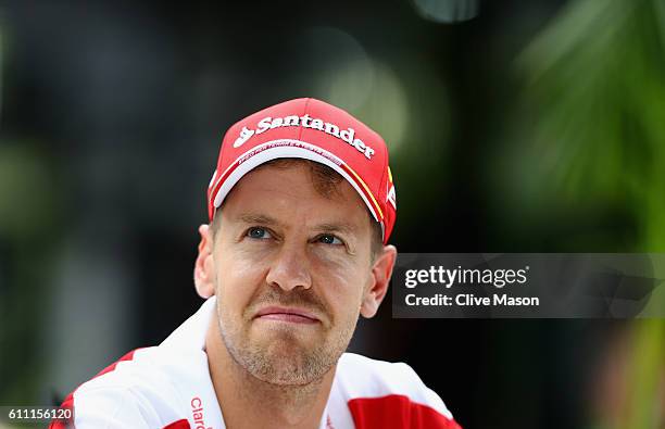 Sebastian Vettel of Germany and Ferrari in the Paddock during previews for the Malaysia Formula One Grand Prix at Sepang Circuit on September 29,...