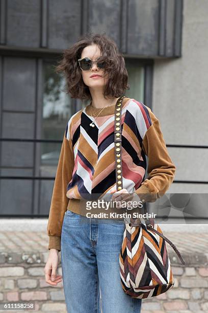 Oyster fashion editor Chloe Hill wears Sonia Rykiel top, Levi"u2019s jeans, and Jerome Dreyfus sunglasses day 3 of London Womens Fashion Week...
