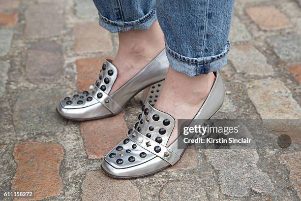 Oyster fashion editor Chloe Hill wears Levi"u2019s jeans and Coach shoes on day 3 of London Womens Fashion Week Spring/Summer 2016, on September 18,...