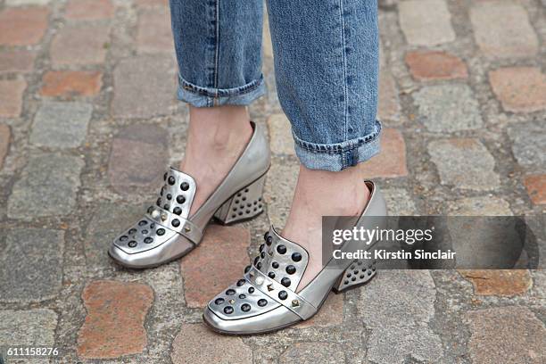 Oyster fashion editor Chloe Hill wears Levi"u2019s jeans and Coach shoes on day 3 of London Womens Fashion Week Spring/Summer 2016, on September 18,...