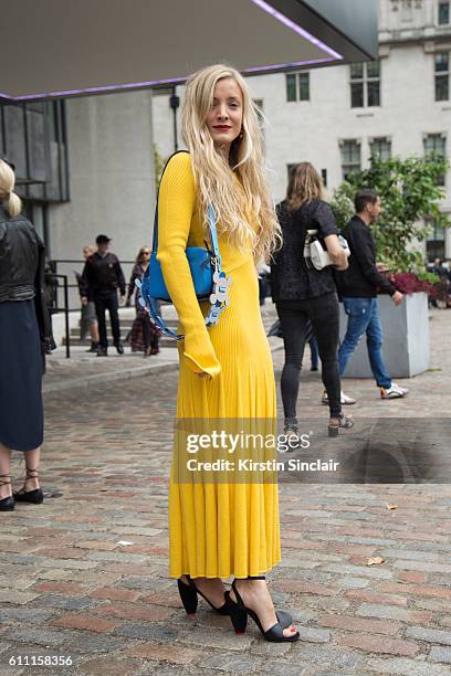 Fashion stylist Kate Foley wears Cedric Charlier dress, Celine shoes and a Anya Hindmarch bag on day 3 of London Womens Fashion Week Spring/Summer...