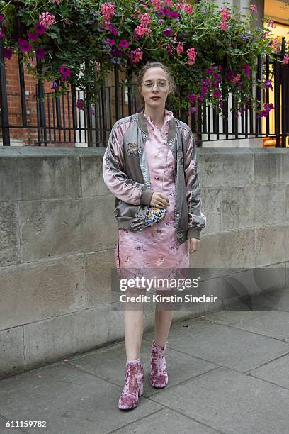 Fashion blogger Sabrina Carder wears all outfit vintage and ASOS boots on day 3 of London Womens Fashion Week Spring/Summer 2017, on September 18,...