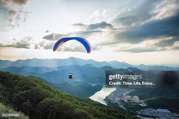 be a part of the landscape - paragliding bildbanksfoton och bilder