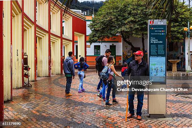 bogota, colombia - tourists on plaza chorro de quevedo - plaza del chorro de quevedo stock pictures, royalty-free photos & images