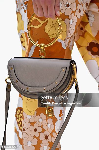 Model, bag detail, walks the runway during the Chloe show as part of the Paris Fashion Week Womenswear Spring/Summer 2017 on September 29, 2016 in...