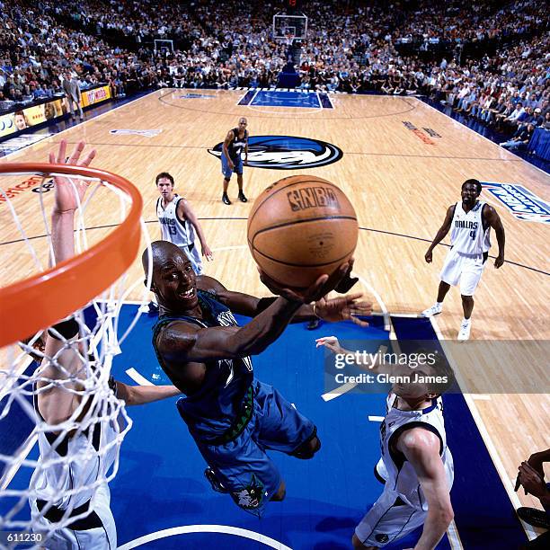 Kevin Garnett of the Minnesota Timberwolves drives to the basket for a reverse layup against the Dallas Mavericks during Game 2 of the Western...