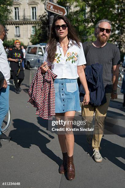 Fashion News Editor at Vogue Magazine Alessandra Codinha wears a Tessa Perlow shirt, Vintage skirt and bag on day 2 of Paris Womens Fashion Week...