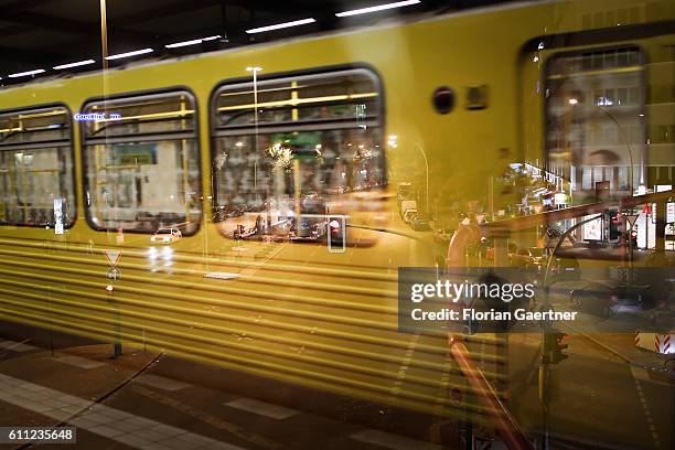 Metro is reflected on a window with the view to a crossroad on September 28, 2016 in Berlin, Germany.