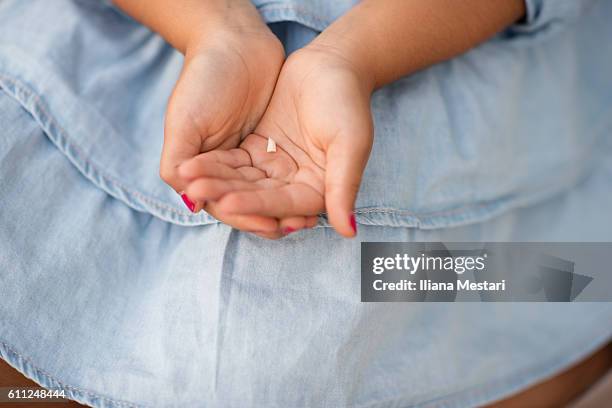 a young girl changing teeth - tooth fairy stockfoto's en -beelden