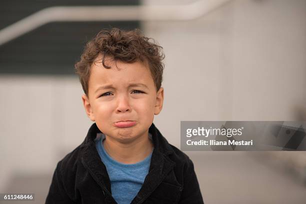 grumpy little boy - child crying stock-fotos und bilder