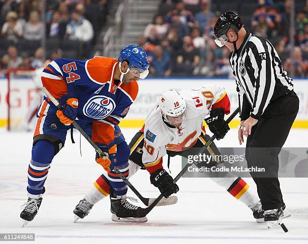 Jujhar Khaira of the Edmonton Oilers faces off against Linden Vey of the Calgary Flames on September 26, 2016 at Rogers Place in Edmonton, Alberta,...