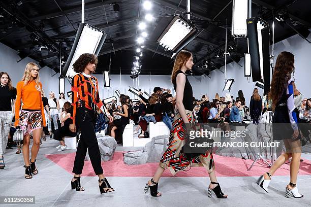 Models present creations for Carven during the 2017 Spring/Summer ready-to-wear collection fashion show, on September 29, 2016 in Paris. / AFP /...