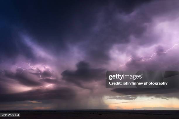 forked lightning inside a thunderstorm at sunset over the great plains of texas. usa - dark sky stock pictures, royalty-free photos & images