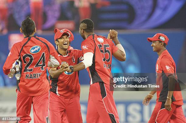 Kieron Pollard of Trinidad celebrates the wicket of Moises Henriques of the Blues during the Airtel Champions League Twenty20 Final between the NSW...