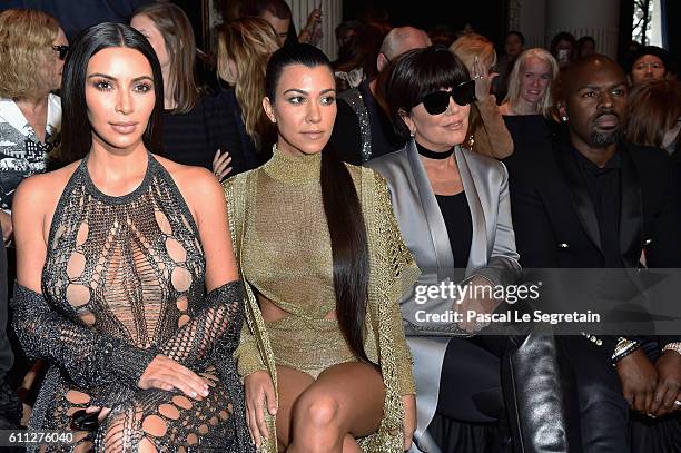 Kim Kardashian, Kourtney Kardashian, Kris Jenner and Corey Gamble attend the Balmain show as part of the Paris Fashion Week Womenswear Spring/Summer...