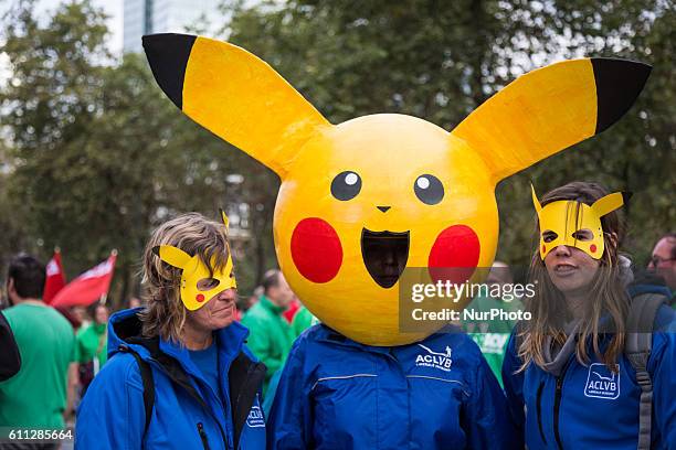 Liberal union members wear "Pikachu" masks during a demonstration against the center-right government's austerity policy after various...