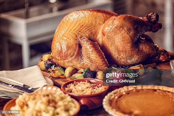 stuffed turkey and pumpkin pie - roast turkey stock pictures, royalty-free photos & images