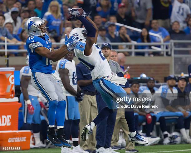 Perrish Cox of the Tennessee Titans reaches for the football in front of Golden Tate of the Detroit Lions during an NFL game at Ford Field on...