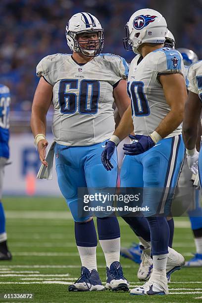 Ben Jones of the Tennessee Titans talks with teammate Chance Warmack during an NFL game against the Detroit Lions at Ford Field on September 18, 2016...