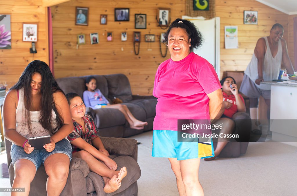 MAORI woman with family at home