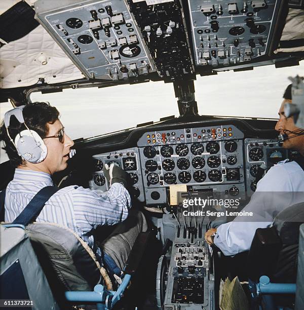 Charles, Prince of Wales in the cockpit of an aircraft during a tour of Australia, circa 1974.