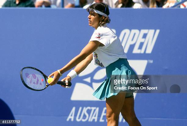 Tennis player Gigi Fernandez of Puerto Rico serves during the women 1994 U.S. Open Tennis Tournament at the USTA National Tennis Center in the Queens...